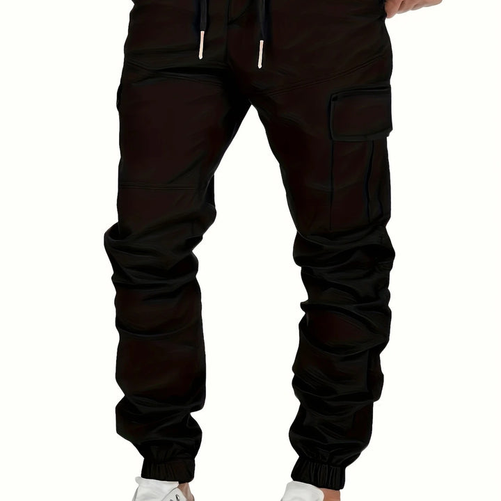 Men's cargo joggers with drawstring, elastic cuffs, and large flap pockets Mune Fashion