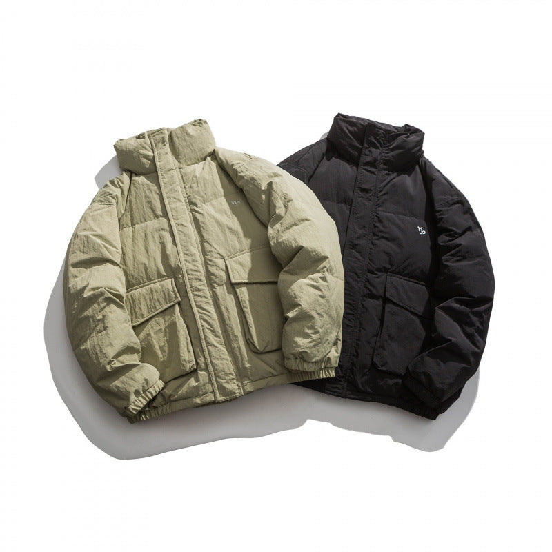 Unisex Oversized padded quilted jacket with high stand collar, large flap pockets and crinkle effect Mune Fashion