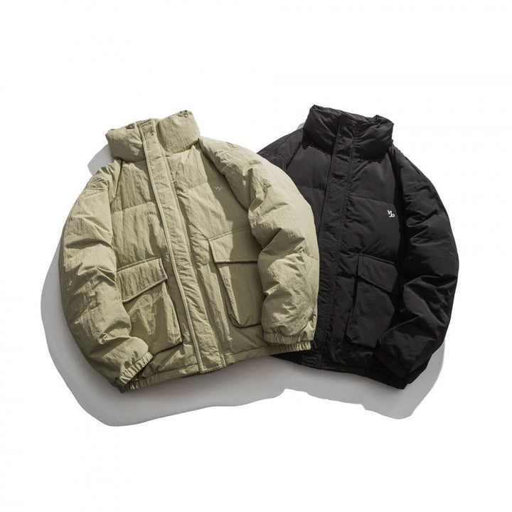 Unisex Oversized padded quilted jacket with high stand collar, large flap pockets and crinkle effect Mune Fashion