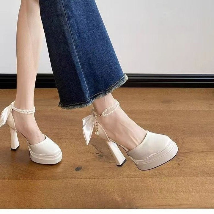 Ladies' satin platform pumps with decorative bow and adjustable ankle strap Mune Fashion