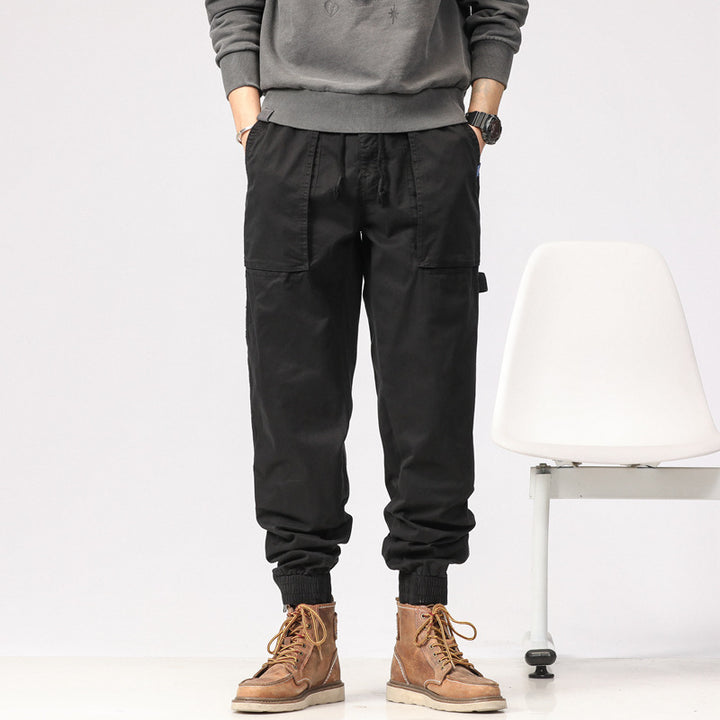 Men's workwear cargo pants in tech jogger style with applied front pockets, hammer loop, and ankle zippers Drune