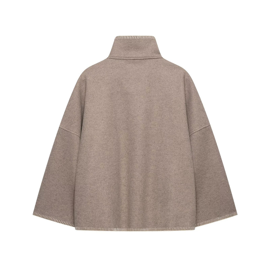 Women's wool blend cape with high stand-up collar, decorative stitching and button placket Mune Fashion