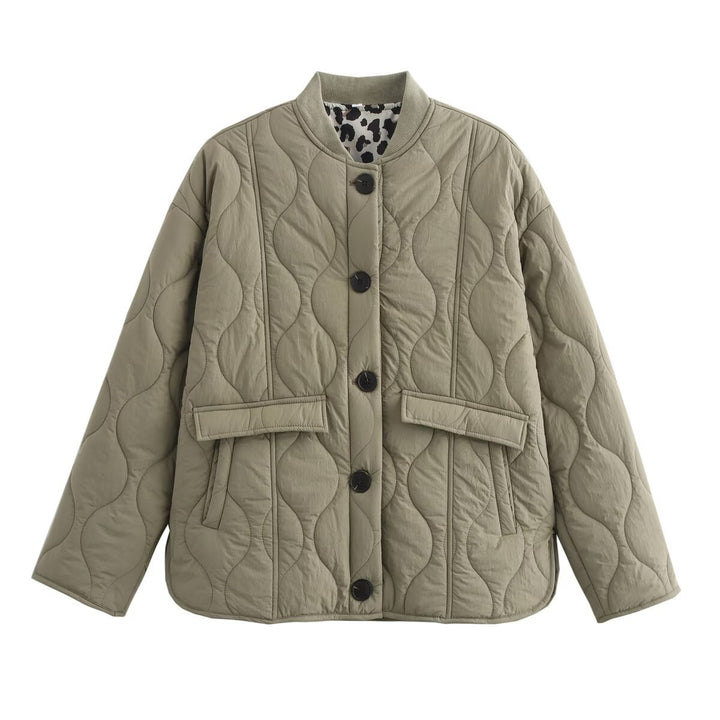 Women's quilted jacket with round neck, flap pockets, and reversible lining Mune Fashion