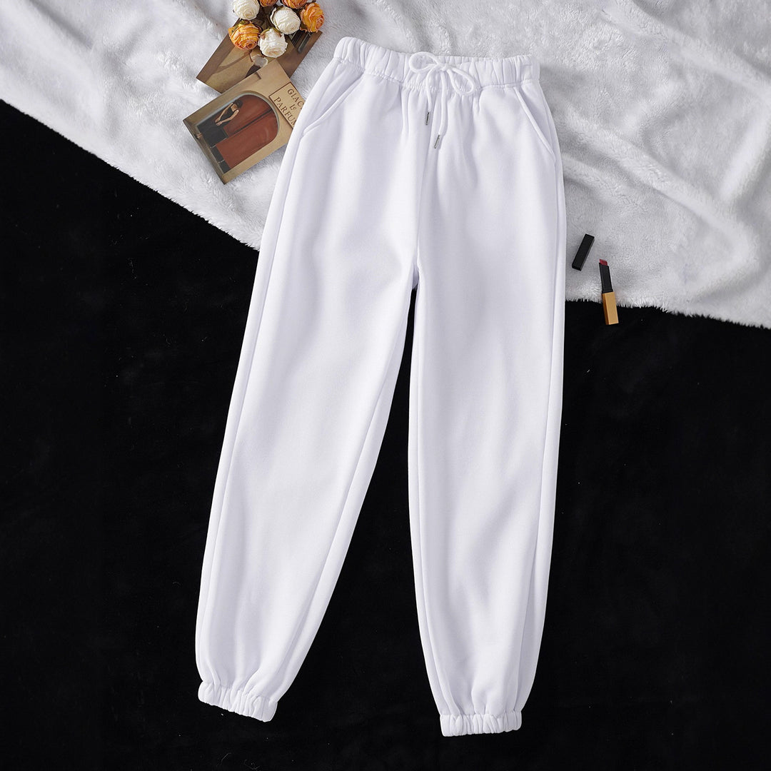 Women's high-cut joggers made of soft fleece cotton blend with elastic waistband, drawstring, and side pockets Mune Fashion