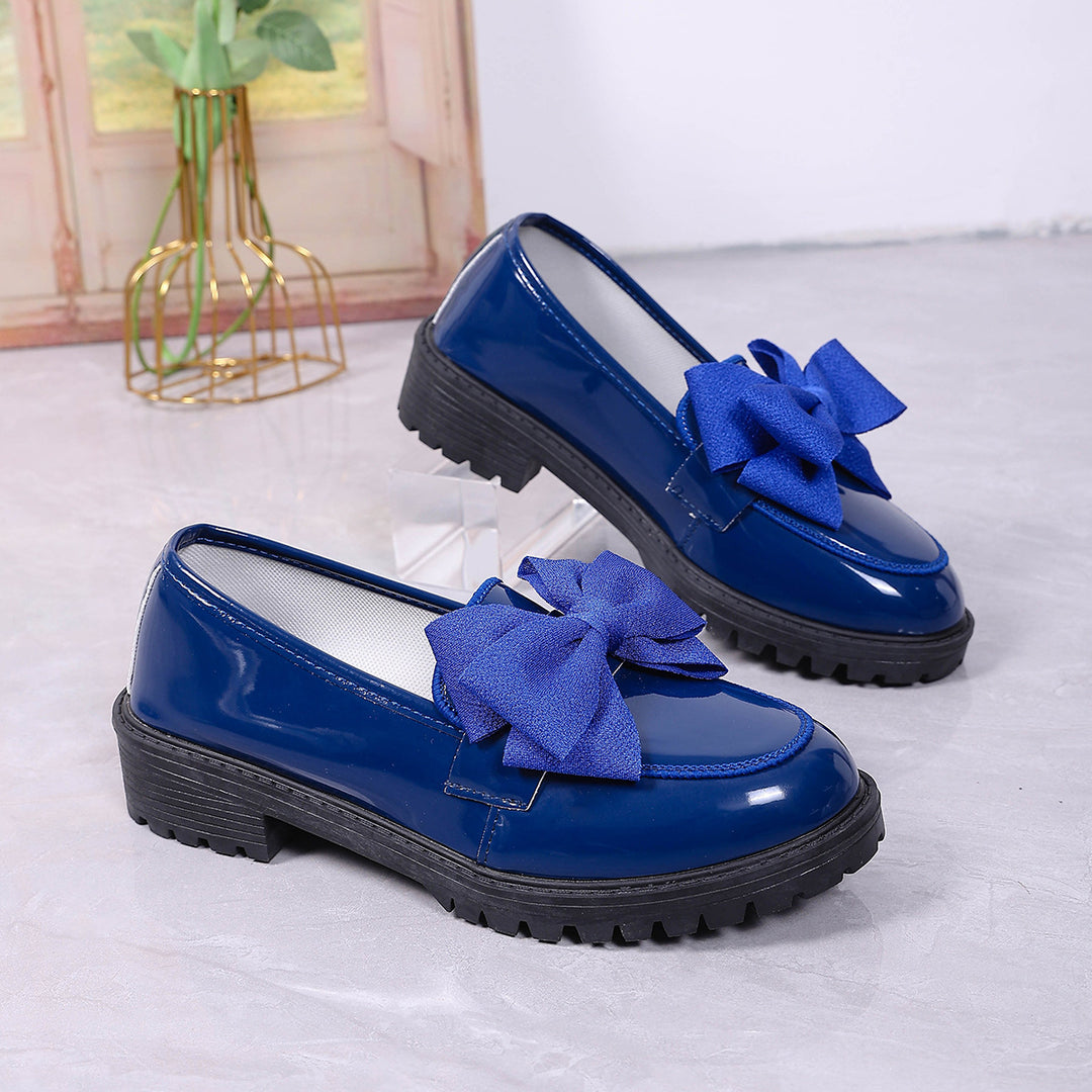 Women's patent leather platform loafers with patterned rubber sole and decorative bow Mune Fashion