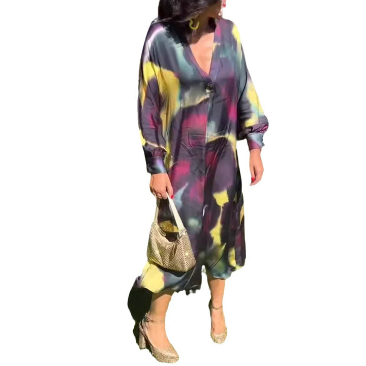 Women's flowing midi dress with abstract print, V-neckline, balloon sleeves, and decorative closure Mune Fashion