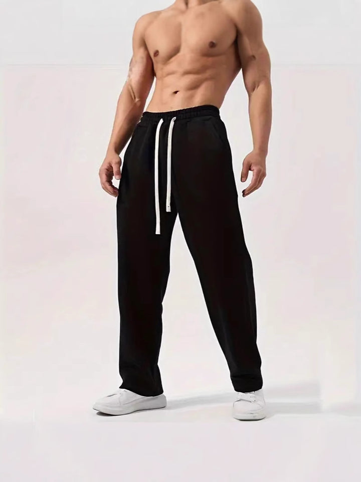 Men's casually fitting sweatpants made of cotton blend with elastic waistband and side pockets Mune Fashion