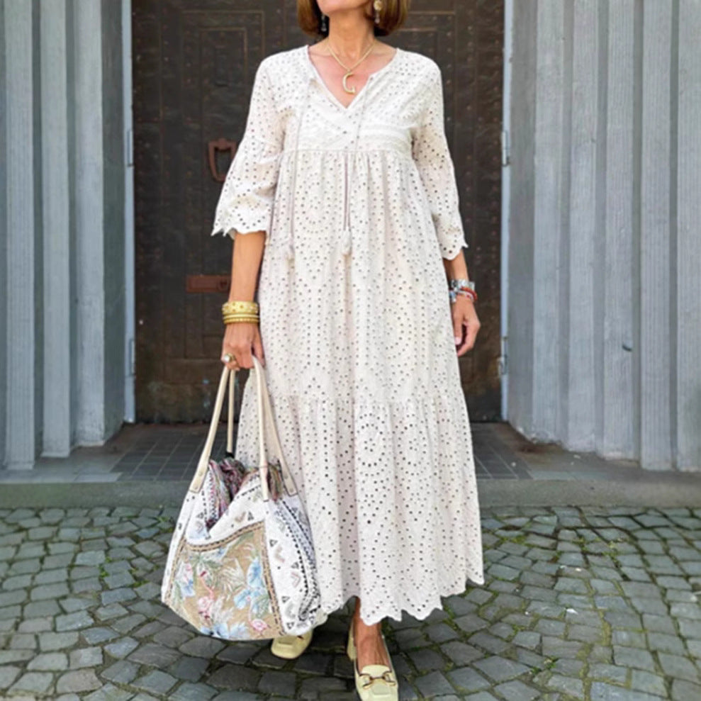 Women's flowing maxi dress with openwork embroidery, V-neck, underbust seam, and ruffled skirt Mune Fashion
