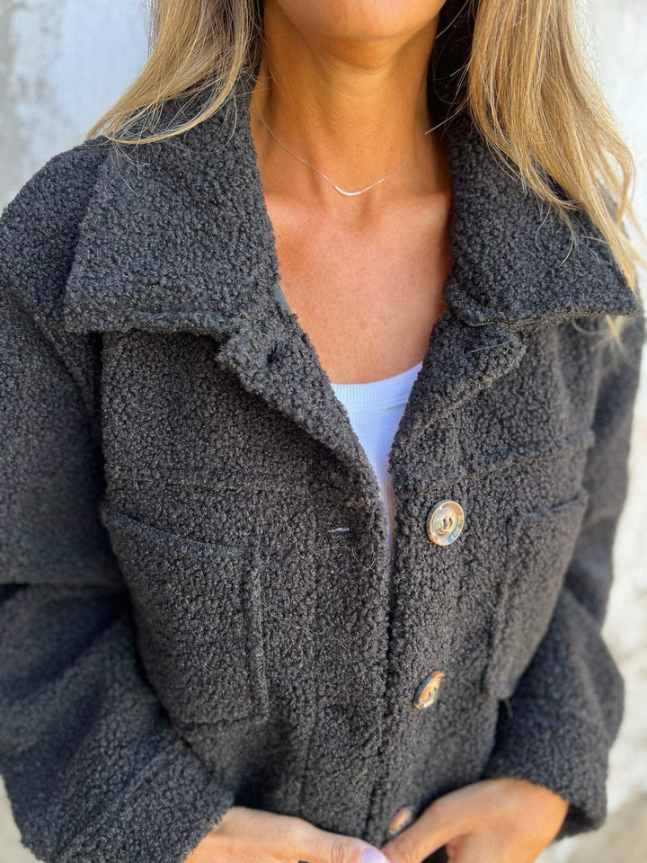 Ladies teddy jacket with large lapel collar, continuous button placket, and patch pockets Mune Fashion