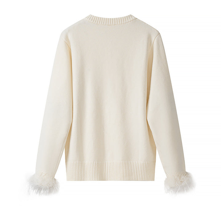 Women’s knit cardigan with pearl buttons and feather-trimmed sleeve cuffs Mune Fashion