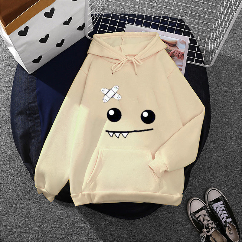 Women's hoodie with playful monster face, bandage application and kangaroo pocket Mune Fashion