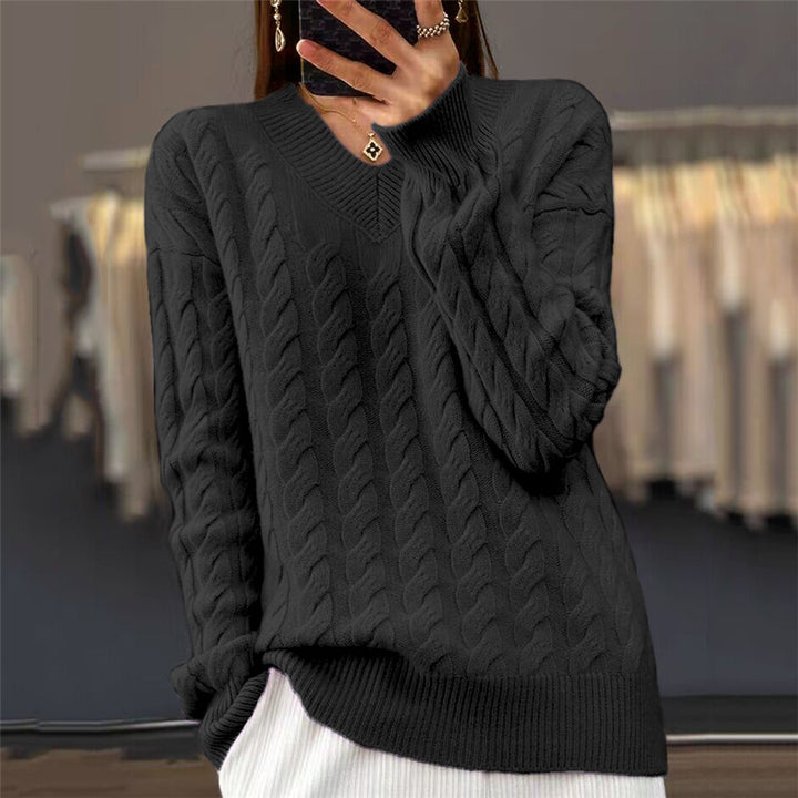 Women's soft draping cable knit sweater with V-neck, oversized cut and ribbed hem Mune Fashion