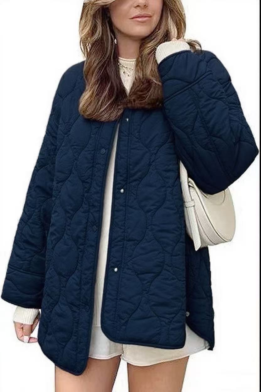 Women's quilted jacket in oversized design with curved quilting and side slit Mune Fashion