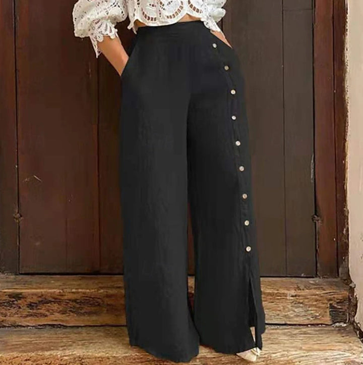 Women's high-waisted linen trousers with a side decorative button placket, side pockets, and wide leg cut Mune Fashion