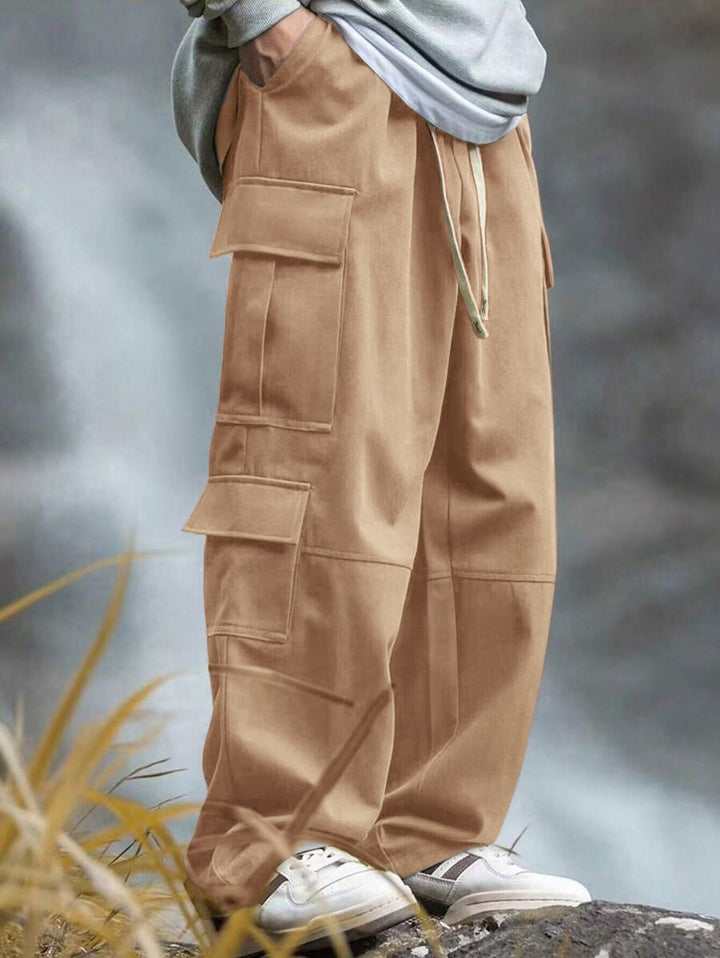 Men's loose cargo pants with multiple pockets, drawstring and reinforced knee areas Mune Fashion