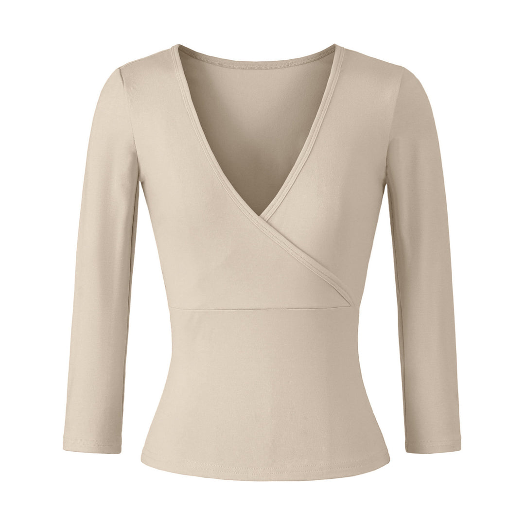 Women's figure-hugging wrap top made of stretch jersey with deep V-neck and tailored silhouette.