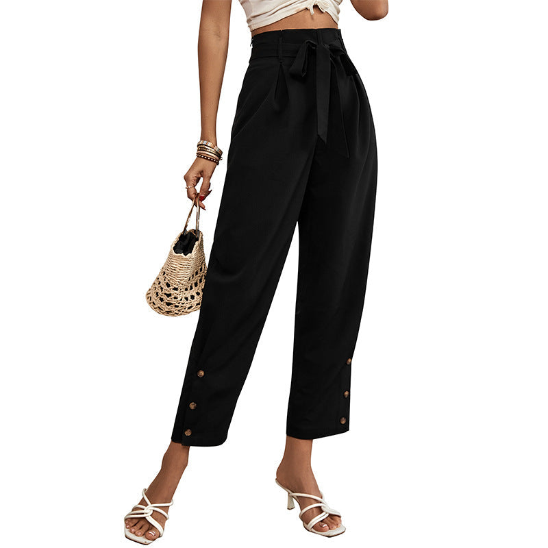 Ladies high-waisted paperbag trousers with tie belt, tapered leg and decorative button placket Mune Fashion