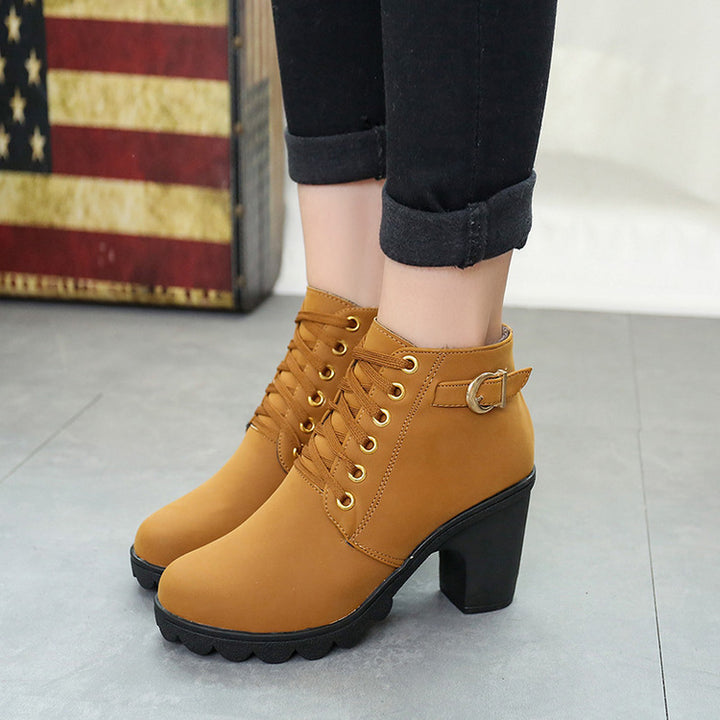 Women's elegant lace-up ankle boots with mid-block heel, grooved rubber sole, and decorative metal buckle Mune Fashion
