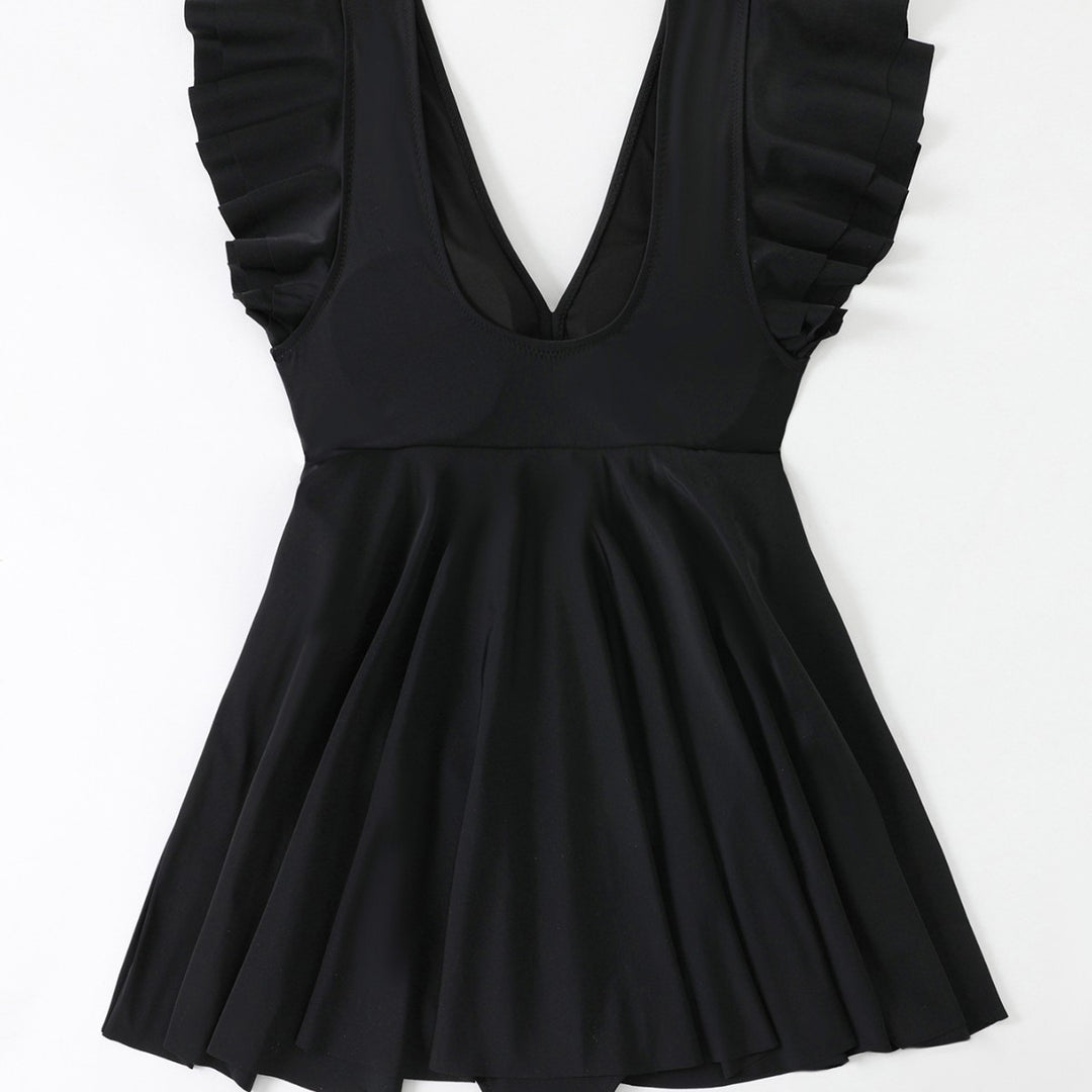 Women's beach dress with a light V-neck and voluminous ruffle details Mune Fashion