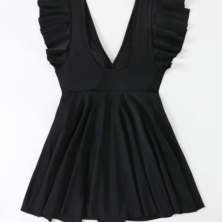 Women's beach dress with a light V-neck and voluminous ruffle details Mune Fashion