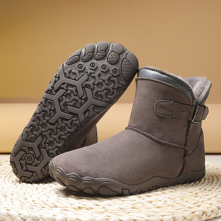 Women's winter ankle boots with faux fur lining, slip-resistant treaded sole, and adjustable buckle strap Mune Fashion