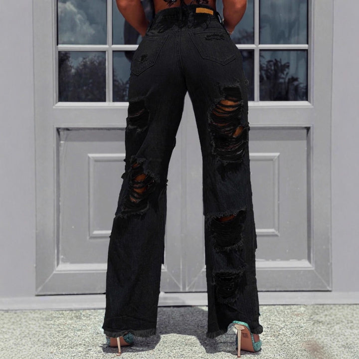 Ladies high-waisted destroyed jeans with wide legs and large knee rips Mune Fashion