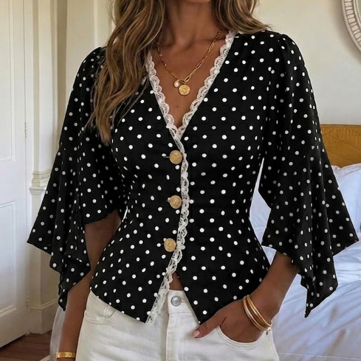 Ladies polka dot blouse with V-neck, lace trim and flared ruffle sleeves Mune Fashion