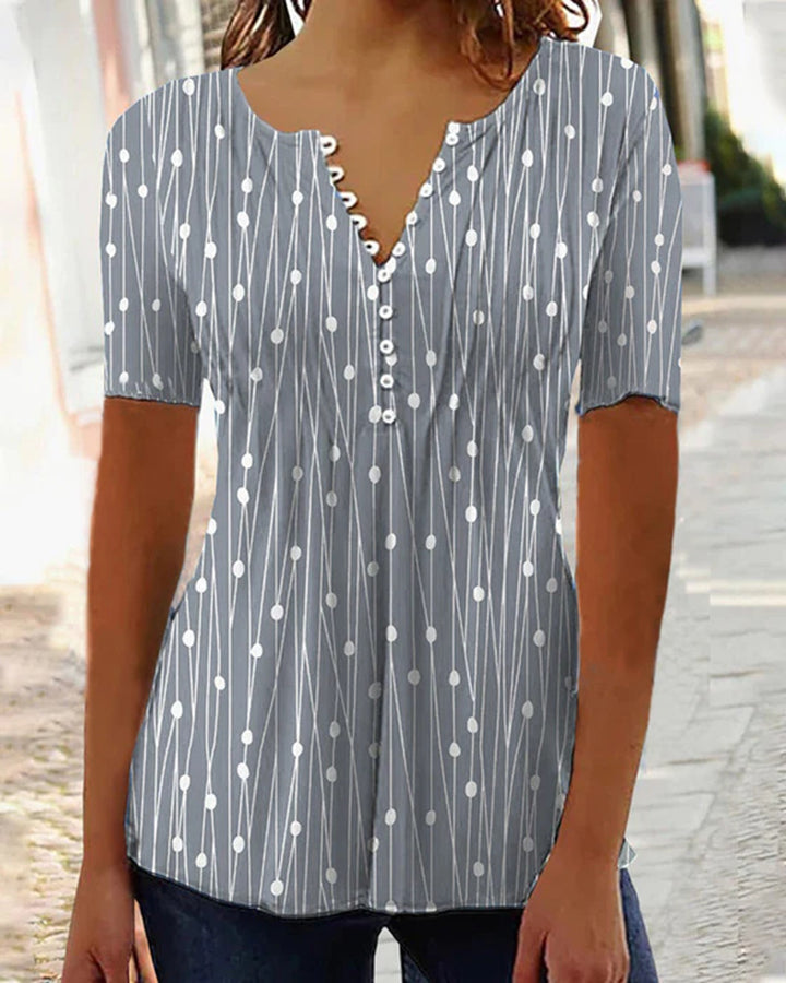 Women's airy V-neck blouse with short sleeves, decorative button placket and graphic dot stripe pattern Mune Fashion