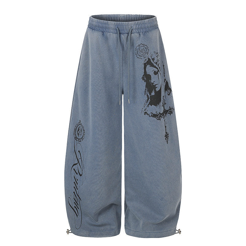 Women's extra-wide palazzo harem pants made of sweatshirt fabric with a high comfort waistband, drawstring, and large graphic print Mune Fashion