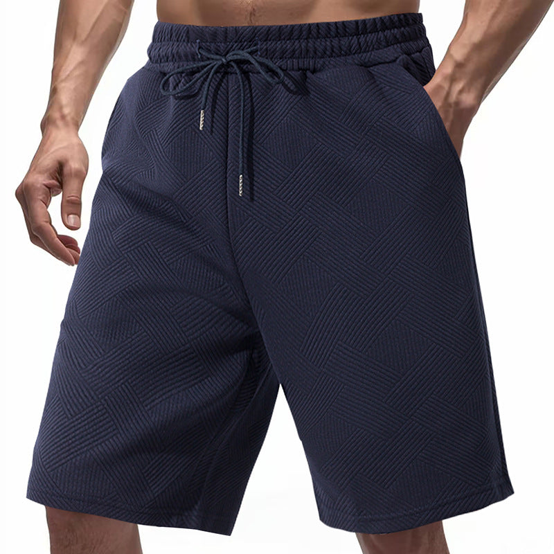 Men's knee-length textured swim shorts with elastic drawstring waistband and side pockets Mune Fashion