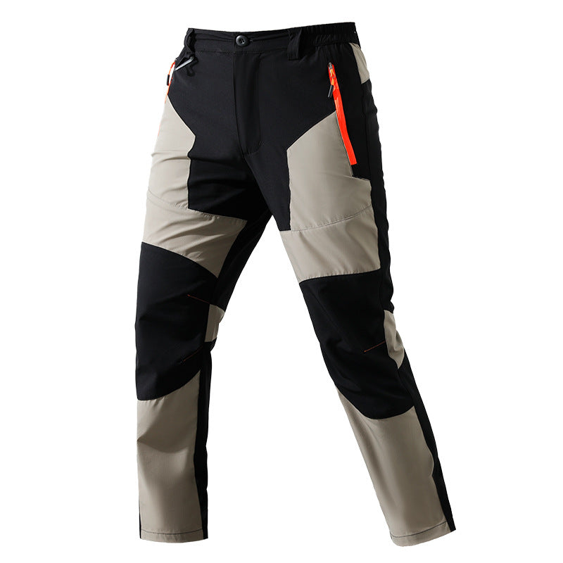 Men's multifunctional trekking pants with multi-way stretch knee reinforcement and elastic waistband.