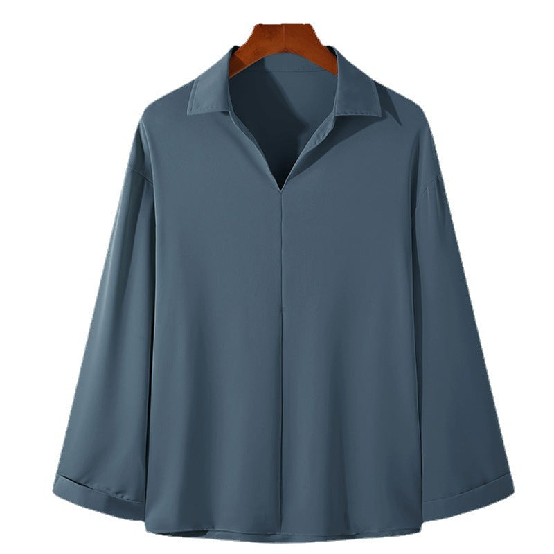 Women's loosely cut tunic blouse with deep V-neck, concealed button placket, and dropped shoulders Mune Fashion