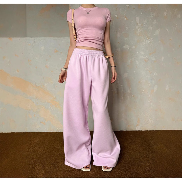 Women's loose lounge pants with elastic waistband, side pockets, and flowing leg Mune Fashion