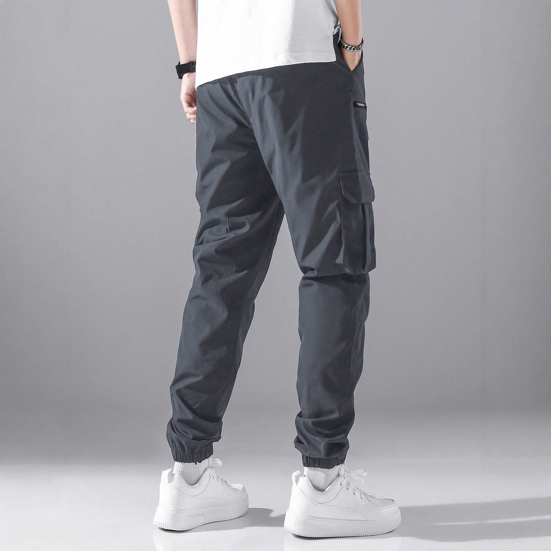 Men's slim cargo joggers with multiple zippered pockets, elastic ankle cuff, and drawstring Mune Fashion