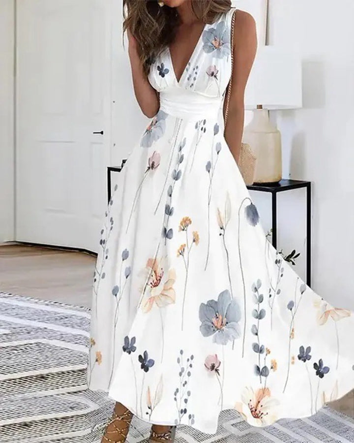 Women's flared midi dress with deep V-neck, empire waist and delicate floral print Mune Fashion