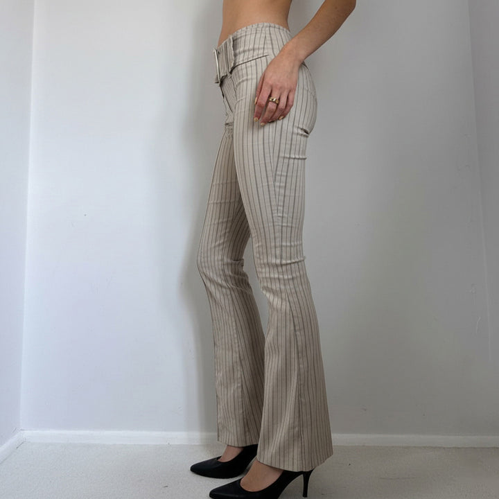 Women’s high-waisted pinstripe flared trousers with wide tie belt and figure-enhancing crease Mune Fashion