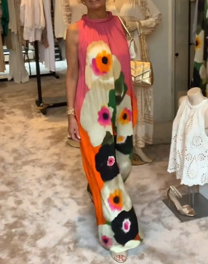 Women's sleeveless maxi dress with ruffled high collar, wide palazzo cut, and large floral print Mune Fashion
