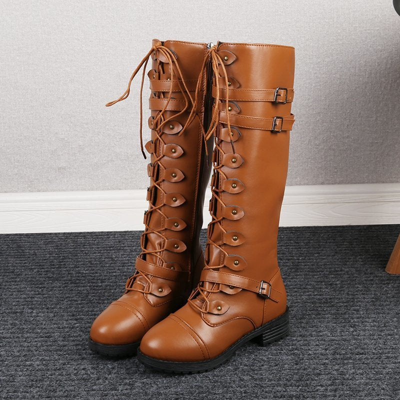 Women knee-high lace-up boots with side zipper, adjustable decorative straps and patterned rubber sole Mune Fashion