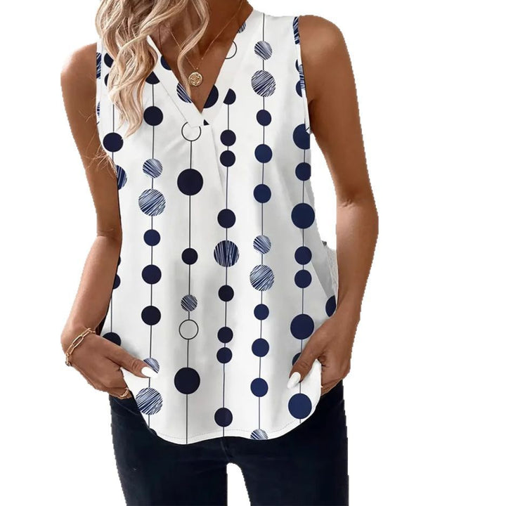 Women's V-neck blouse top with vertical polka dot pattern and subtle center seam Mune Fashion