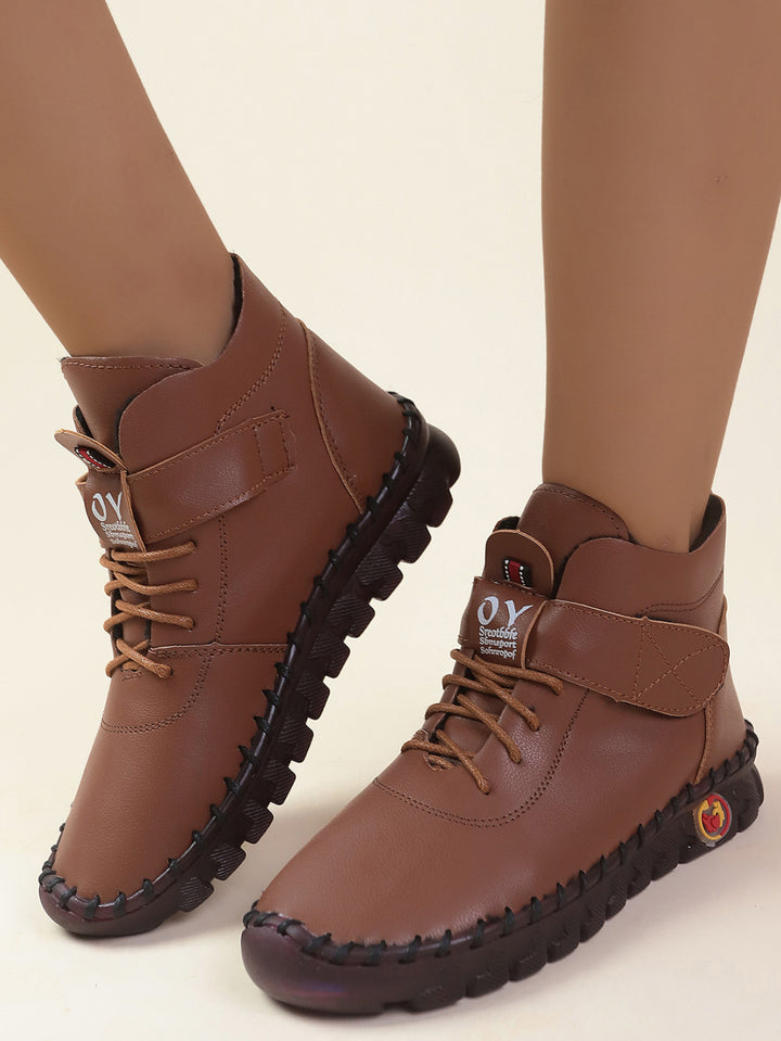 Women ankle-high comfort lace-up booties with Velcro closure and textured rubber outsole Mune Fashion