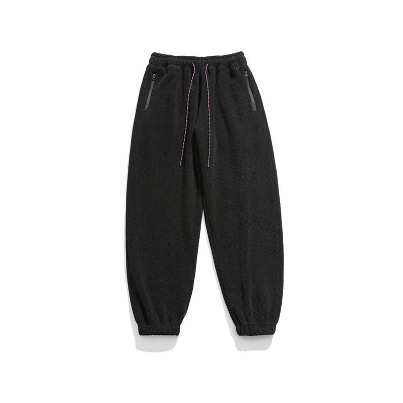 Men's wide-cut fleece jogging pants with elastic cuffs and side pockets Mune Fashion