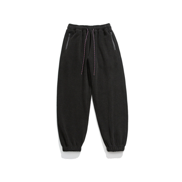 Men's wide-cut fleece jogging pants with elastic cuffs and side pockets Mune Fashion