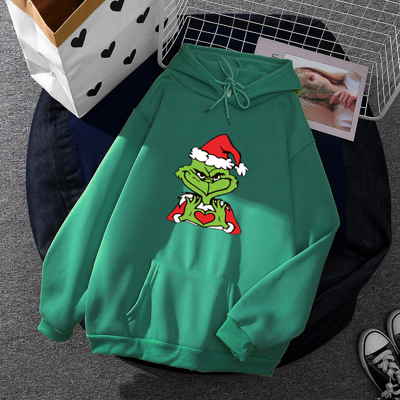 Unisex hoodie with soft fleece lining, kangaroo pocket and eye-catching Christmas comic print Mune Fashion