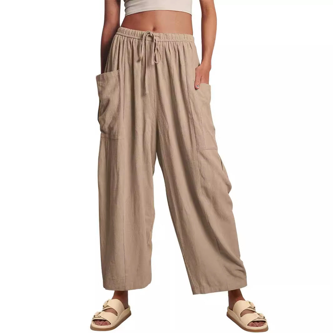 Women's wide palazzo pants made from a lightweight linen blend with drawstring and side pocket Mune Fashion