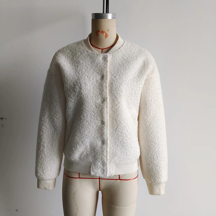 Ladies cozy teddy bomber jacket in college style with concealed snap button placket and integrated pockets Mune Fashion