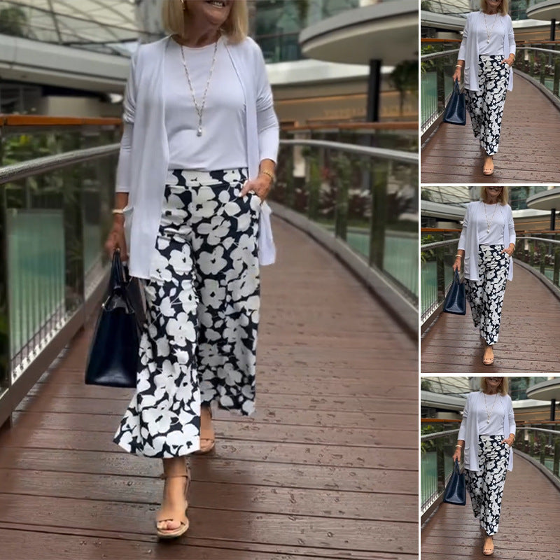Women's wide Palazzo pants with large floral print, high waistband and side pockets Mune Fashion