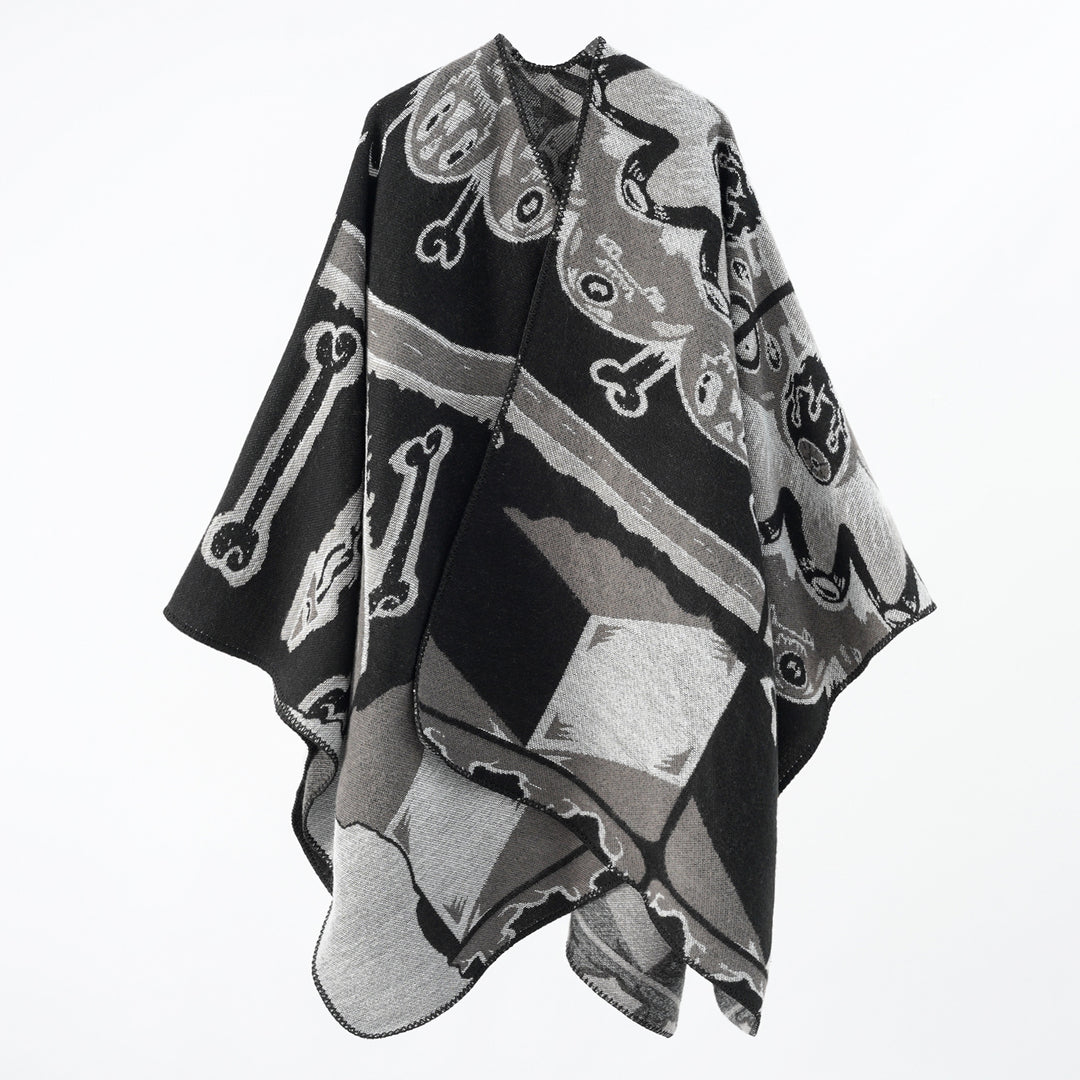 Women's statement cape poncho made from jacquard woven wool blend with skull and bone pattern Mune Fashion