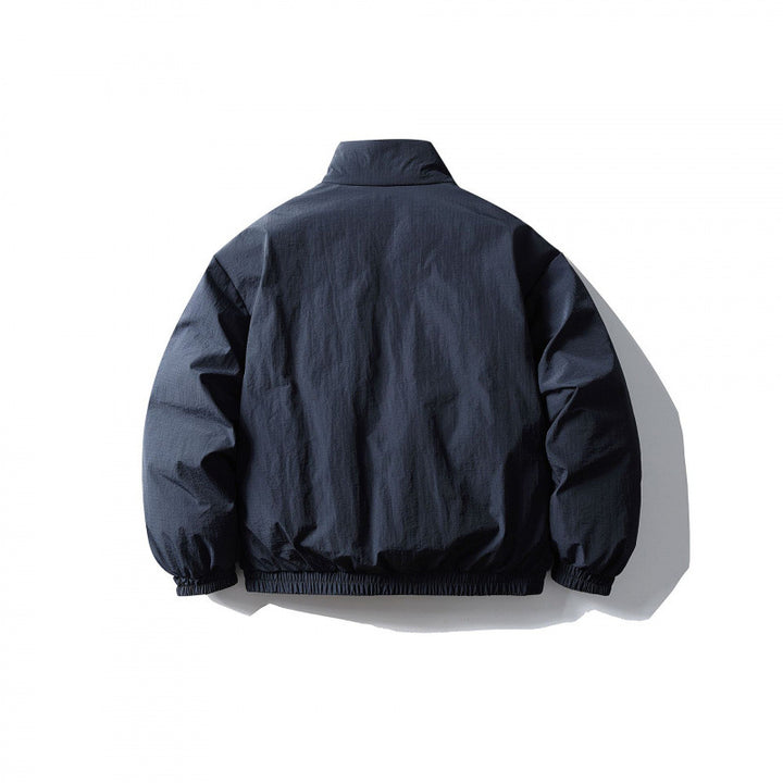 Unisex Boxy quilted transitional jacket with standing collar, elastic hem and zipper pockets Mune Fashion