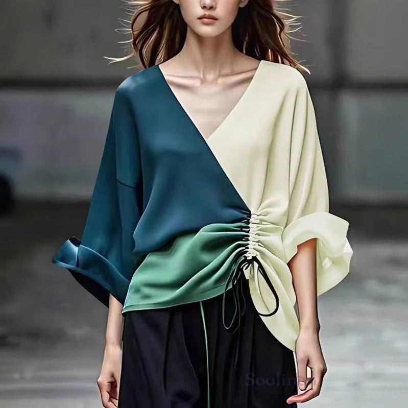 Women's blouse with V-neckline and side gathering cord