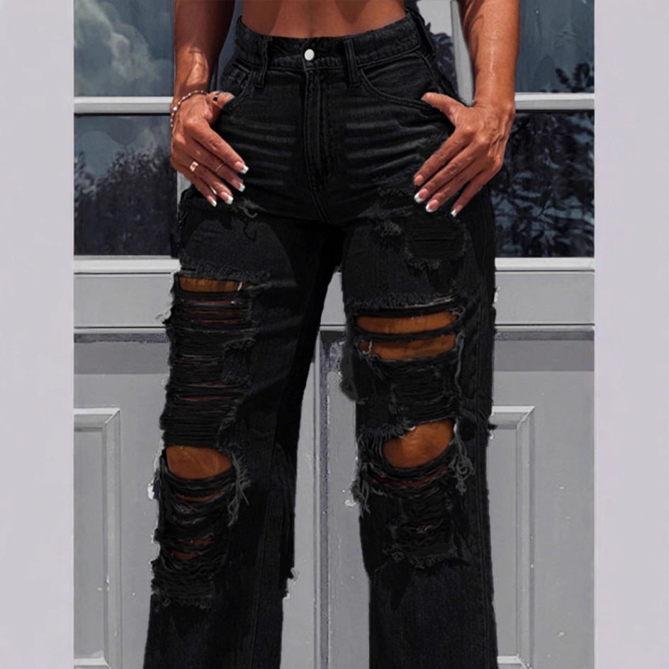 Ladies high-waisted destroyed jeans with wide legs and large knee rips Mune Fashion